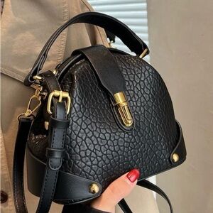 Chic Black Textured Mini Bag with Gold Accents
